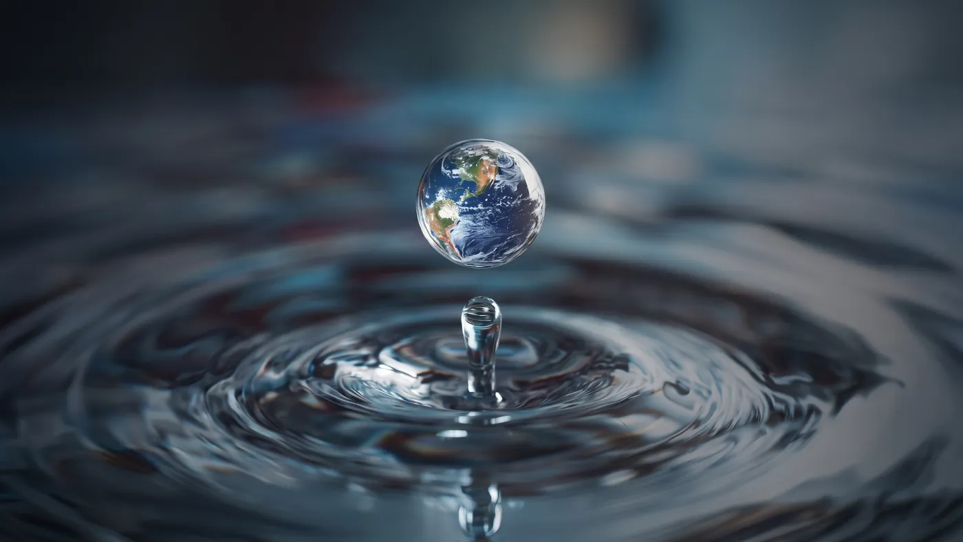 A droplet falling into still water, the image the identity is built from